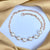 Golden Alloy Link Chain Pearl Bracelet