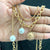 Layered Pearl Drop Sun Charm Necklace